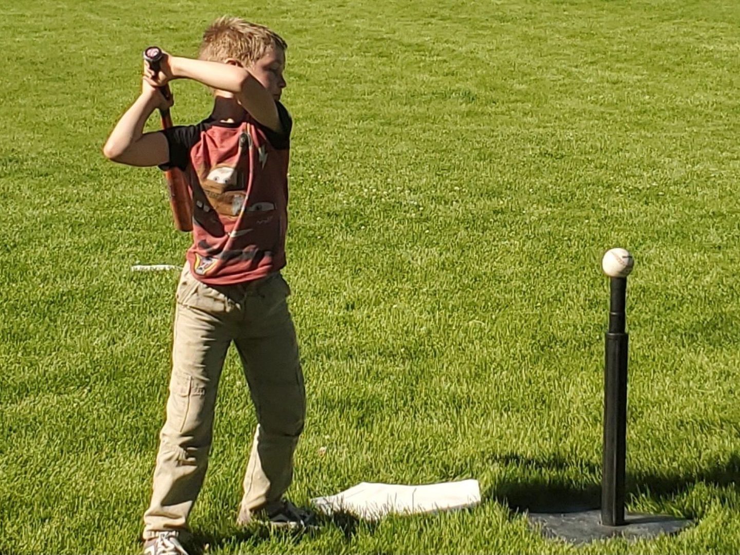 boy hitting ball, tee-ball, all kids play, youth sports nonprofit