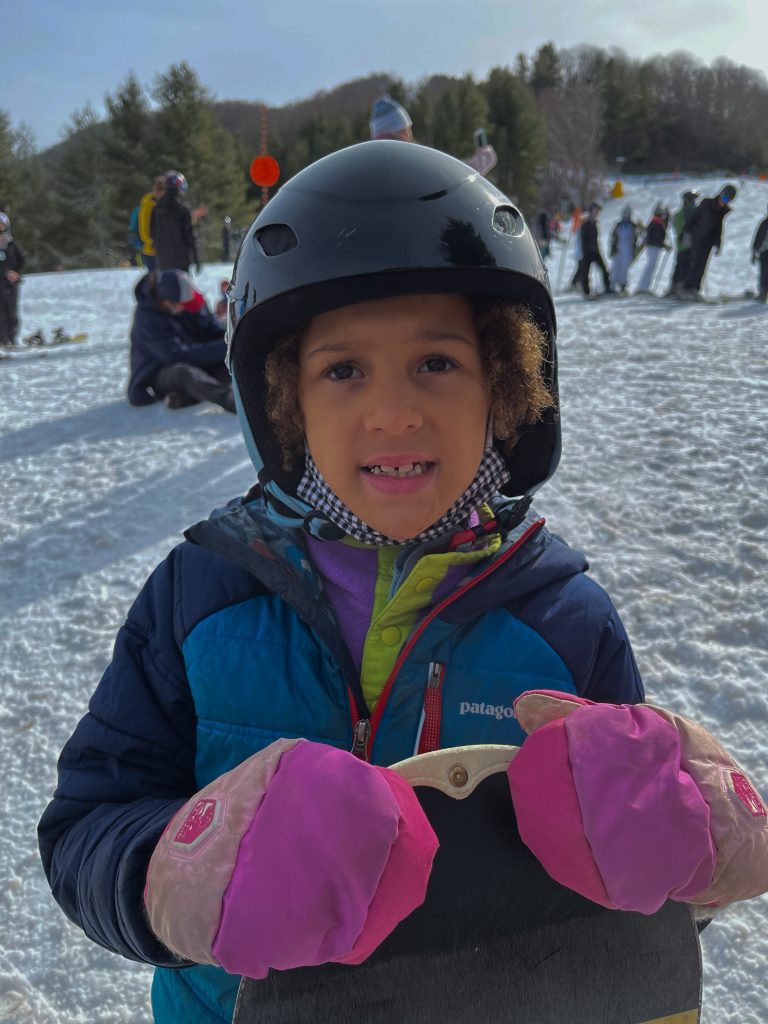 Nola Boone preparing to snowboard at Cataloochee Ski Area with an All Kids Play youth sports grant